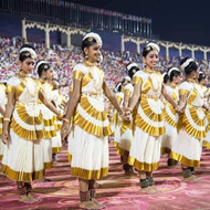 mohiniyattam artists performing on the large stadium ground